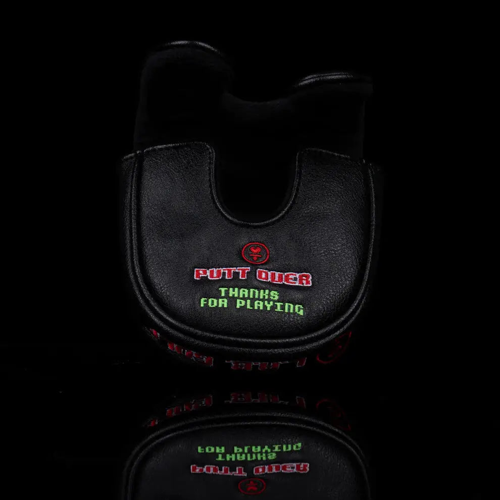Rear angle of LAB Golf Player One Headcover displaying 'Putt Over' and 'Thanks for Playing' in retro gaming style.