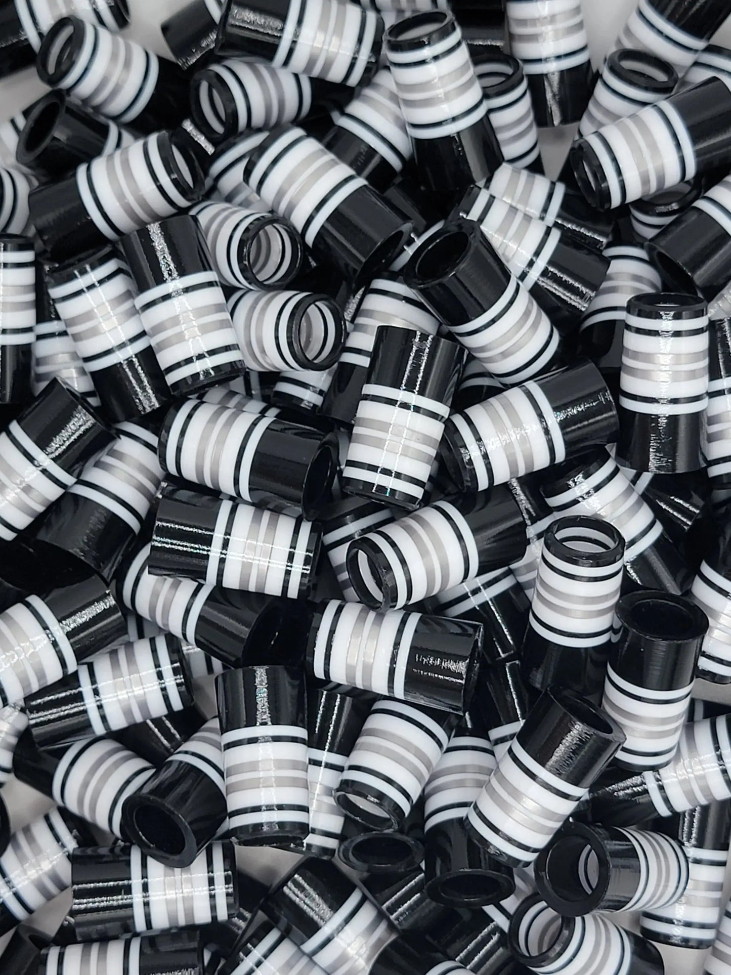Hooch golf ferrules in black and white striped design, ideal for customizing golf clubs. BBF style ferrules for outdoor golf equipment upgrades.