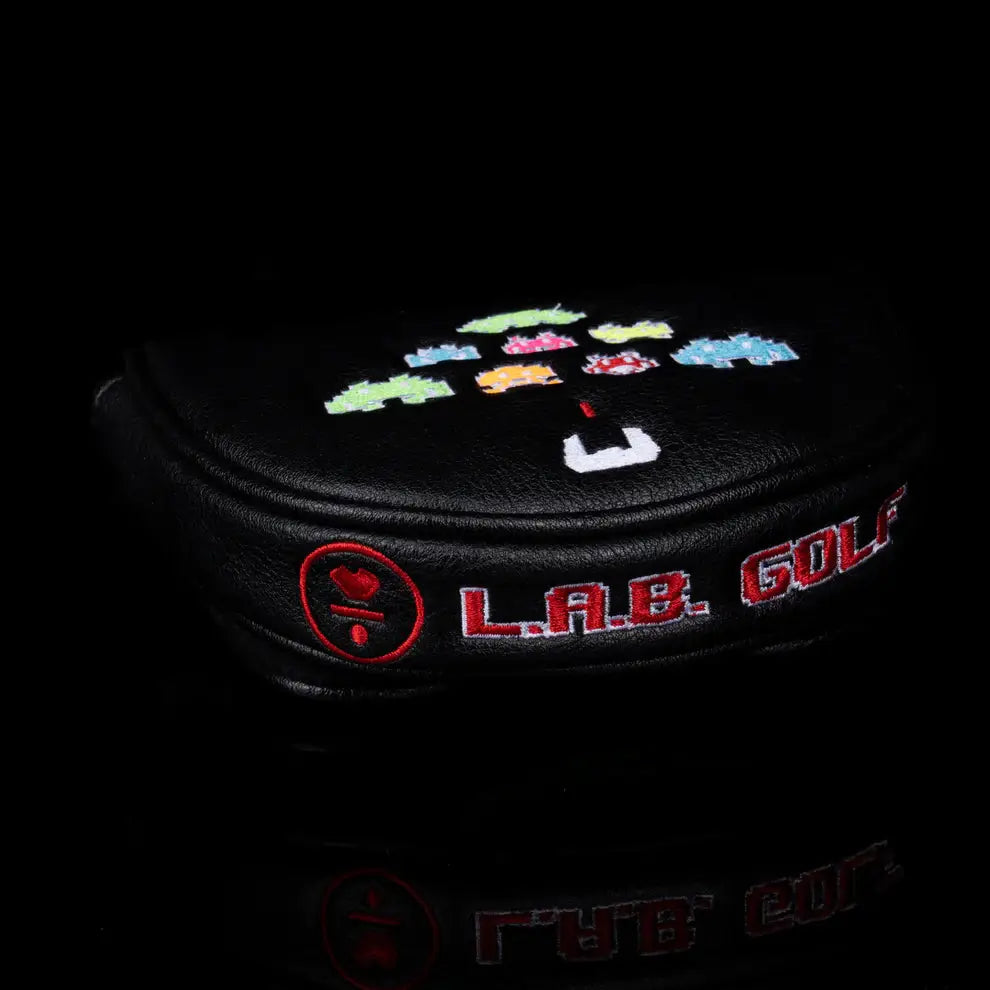 Side view of LAB Golf Player One Headcover showing embroidered L.A.B. Golf logo and pixelated alien graphics.