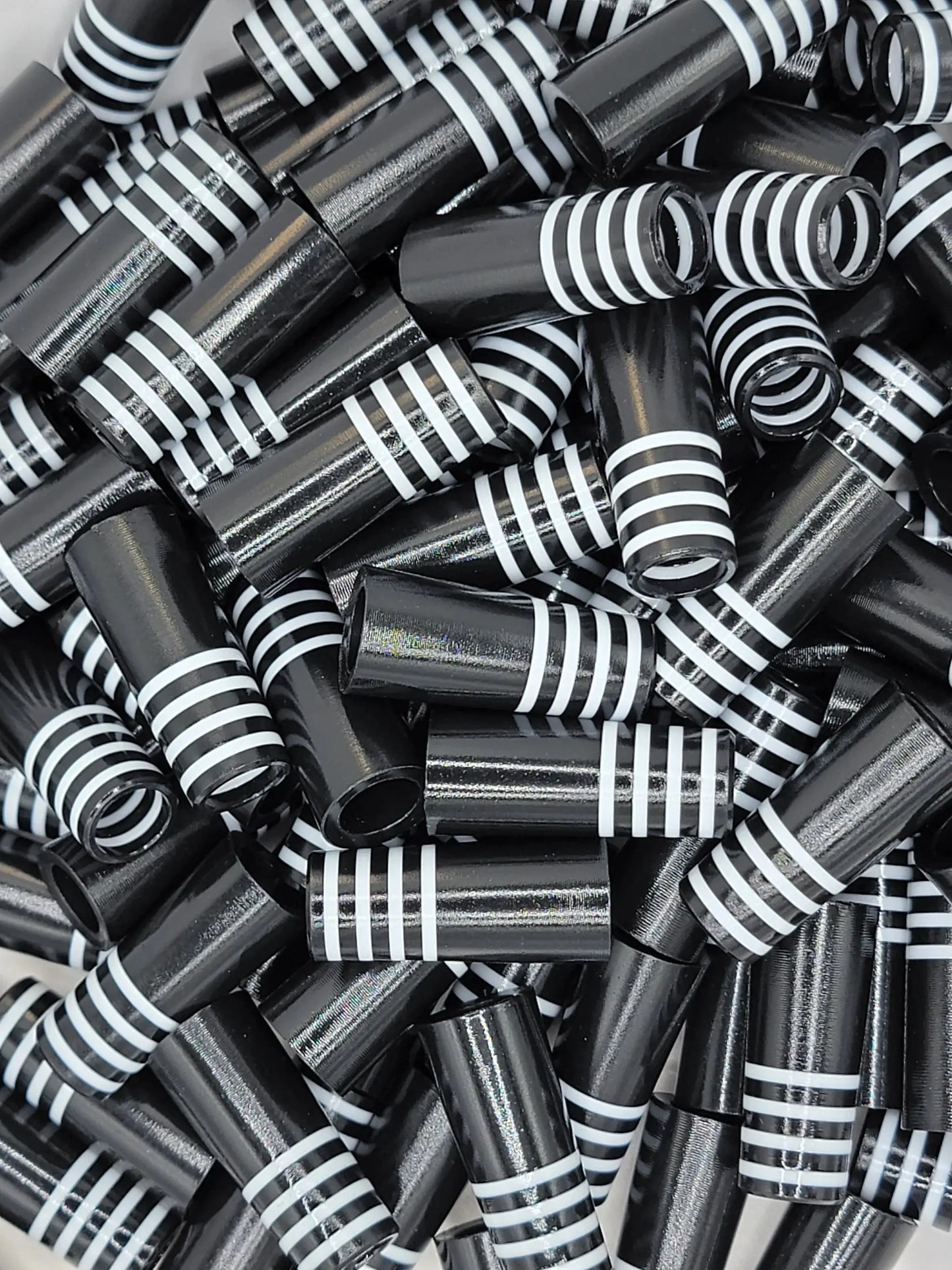 Plus Four black golf ferrules with white BBF stripes, designed for club customization in outdoor recreation and golf accessories.