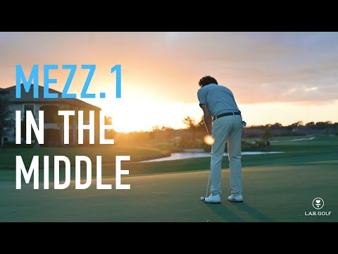 Golfer using Stock LAB Golf MEZZ.1 Putter on green at sunset, showcasing performance and balance in real-game conditions.