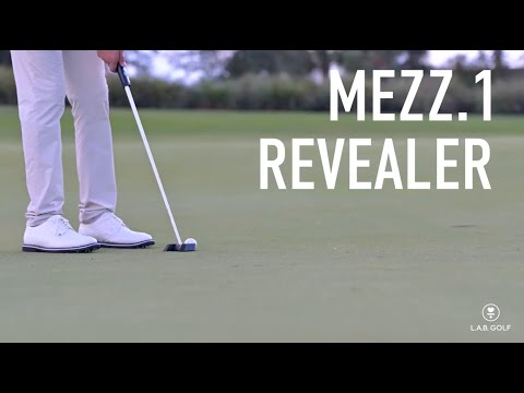 Golfer using LAB Golf MEZZ.1 Max Broomstick Putter on green, demonstrating real-world performance and stability.